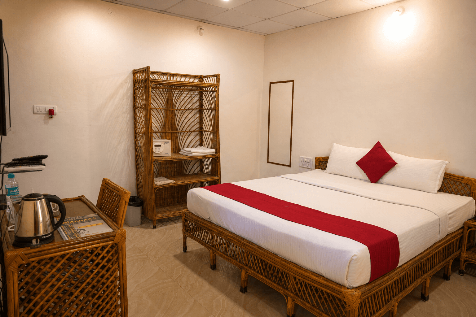 Deluxe room with rattan furniture and red-accent bedding